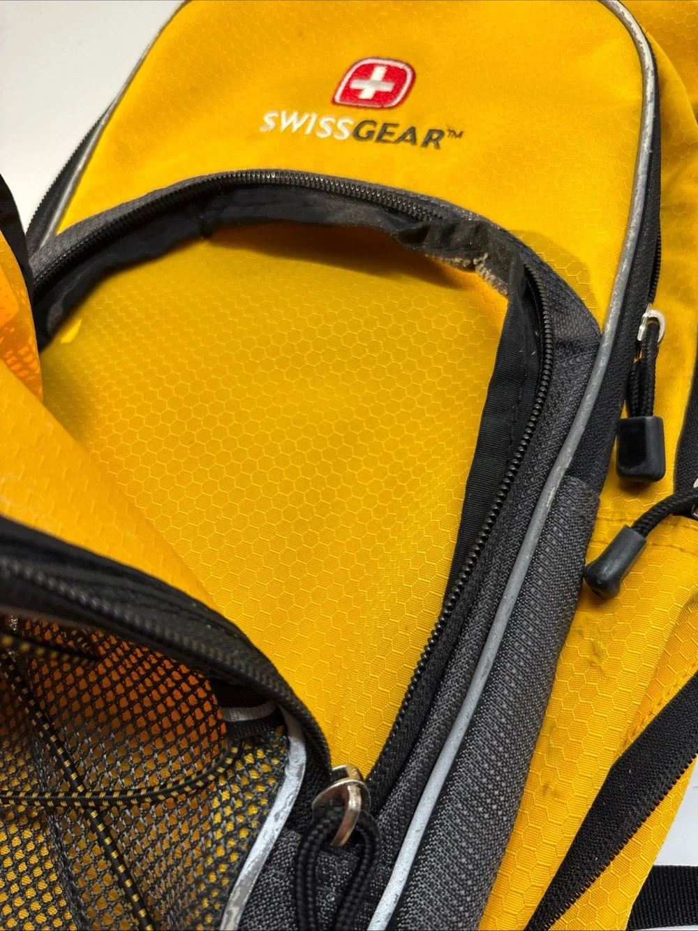 SwissGear unisex Yellow and Black Compact Daypack Backpack.